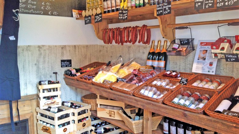 Triad's farm store, © Triad Interior view of a farm store with shelves full of regional products such as wine, sausage, spices and oil.