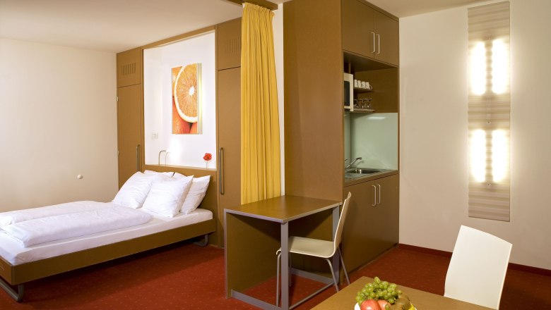Orange Wings Apartmánový pokoj, © Orange Wings/ Wiener Neustadt Orange Wings Apartmánový pokoj, © Orange Wings/ Wiener Neustadt