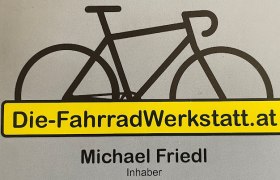 Logo der FahrradWerkstatt mit Fahrrad-Silhouette und gelbem Banner.