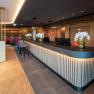 Modern hotel reception with stylish lighting and decoration.