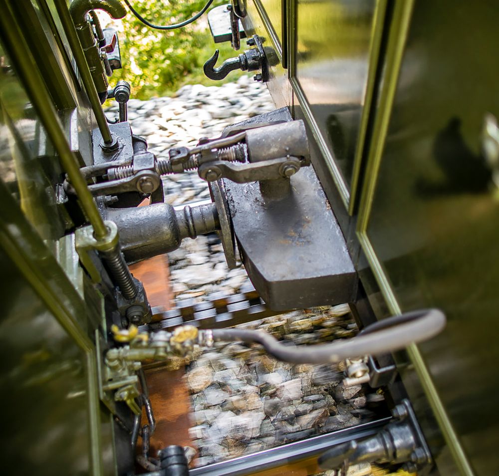 Close-up of a screw coupling between two railroad cars.