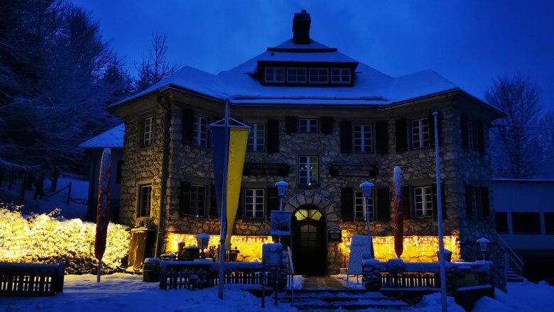 House in winter with outdoor lighting