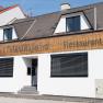 Fa&ccedil;ade of a restaurant called Piestingerhof, decorated with fairy lights.