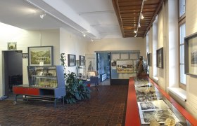 Interior view of the World Heritage Information Center at Semmering railroad station with exhibits and information boards.