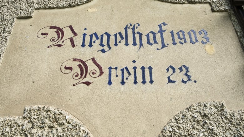 Inschrift 'Riegelhof 1903 Prein 23' auf einer Wand.