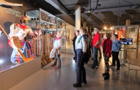 Visitors view an ice hockey exhibition at the Winter Sports Museum.