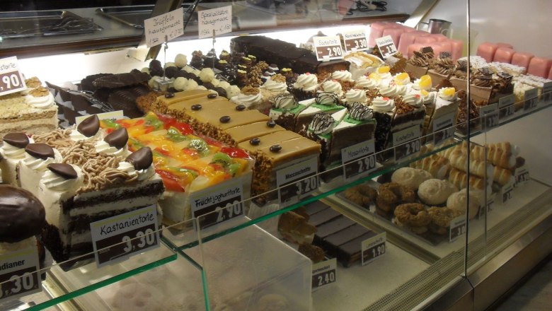 Display case with various cakes and pastries in the K&ouml;ller confectionery.